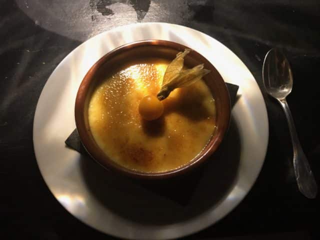 Sweet Creme Brulee On A Plate With A Spoon