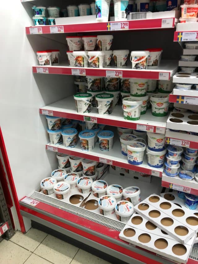 Bucket Dairy Products Stacked On Store Shelves