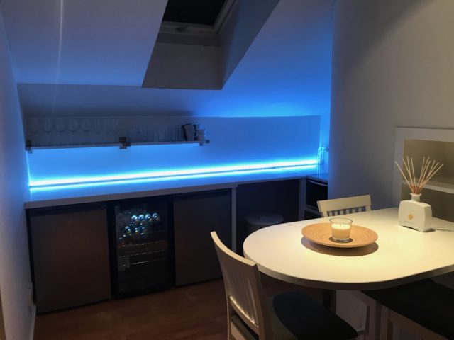 LED Lit Penthouse Kitchen With A Table And Window