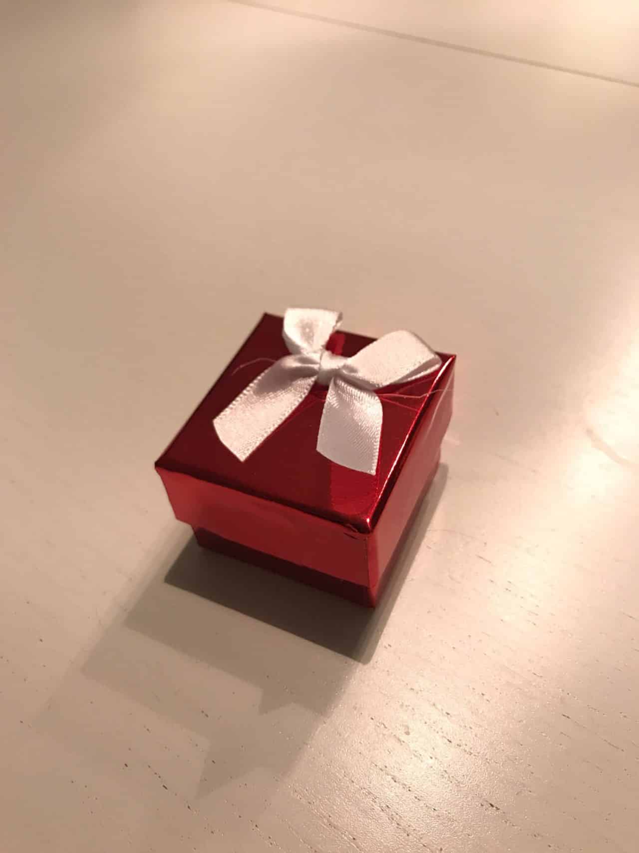 Small Red Gift Box With A White Bow