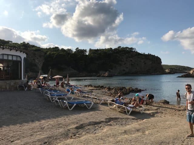 Sunbeds On A Gravel Beach With People
