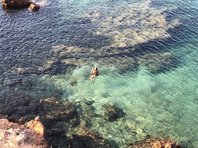 People Swimming In Tropical Water In Ibiza