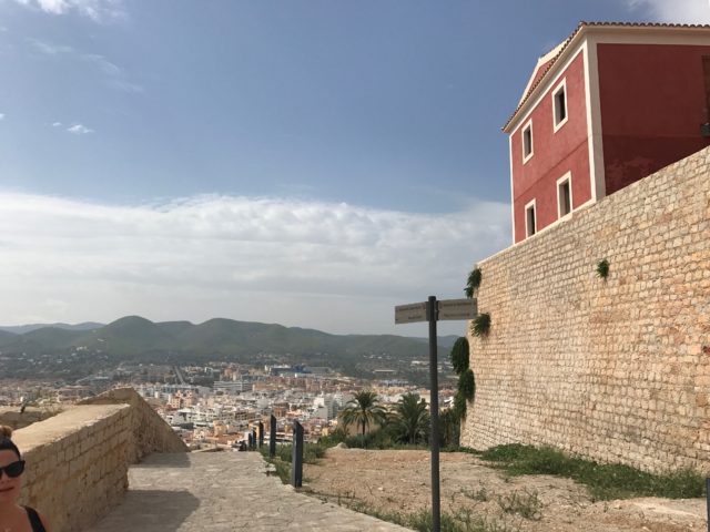 Fortress Stone Pathway With Red House And Rock Walls With City View