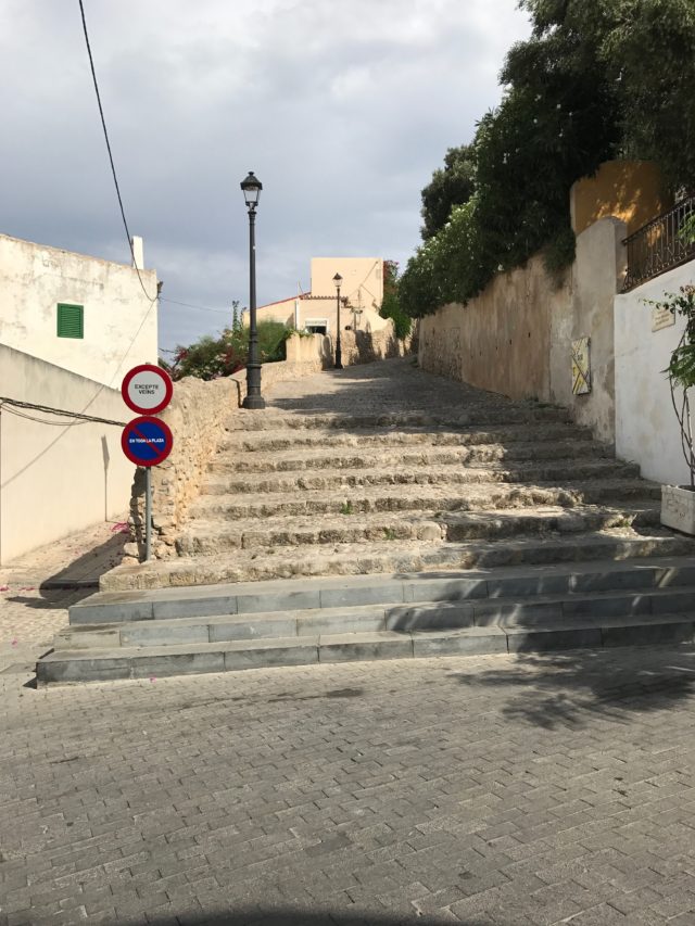Small Town Stairs And Pathway With Street Signs
