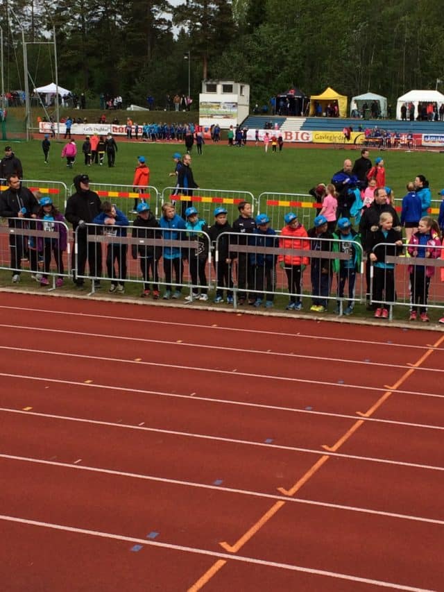 Running Competition At An Athletics Arena With An Audience On The Side
