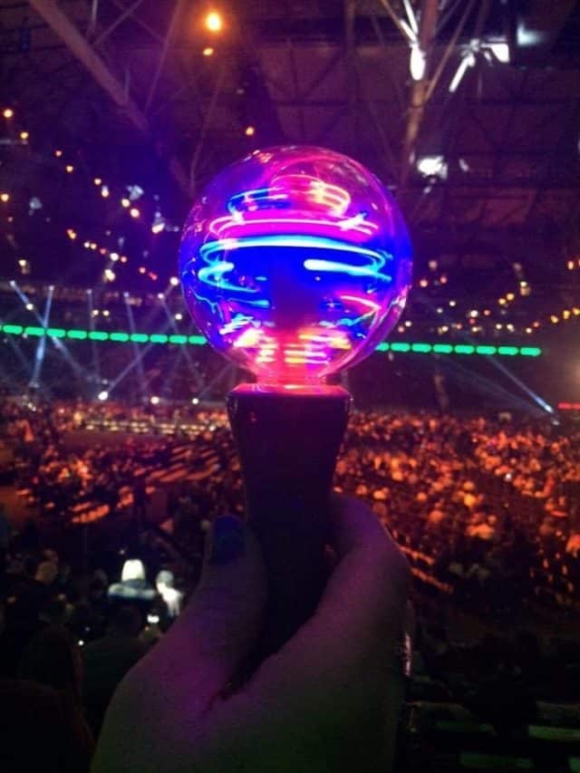Hand Holding Spinning Light At Concert