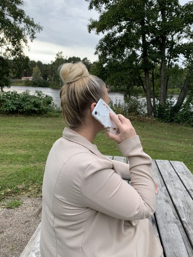 Woman Talking On The Phone With Her Smartphone