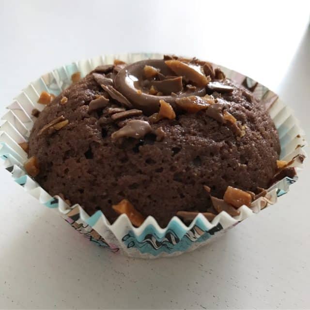 Chocolate And Caramel Muffin In Paper Wrapping