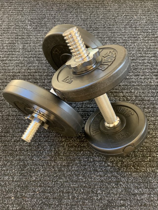Workout Equipment Weight Dumbbells On Gym Floor