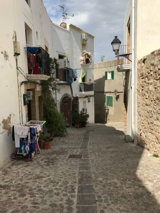 Picturesque Street With Laundry In Ibiza In Spain