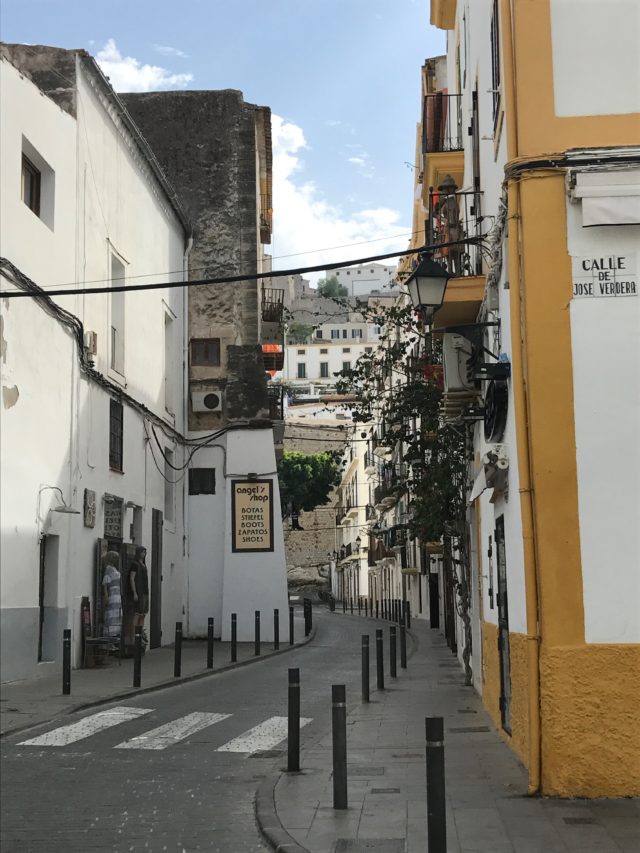 Narrow Street Alley With Sidewalk In Spain
