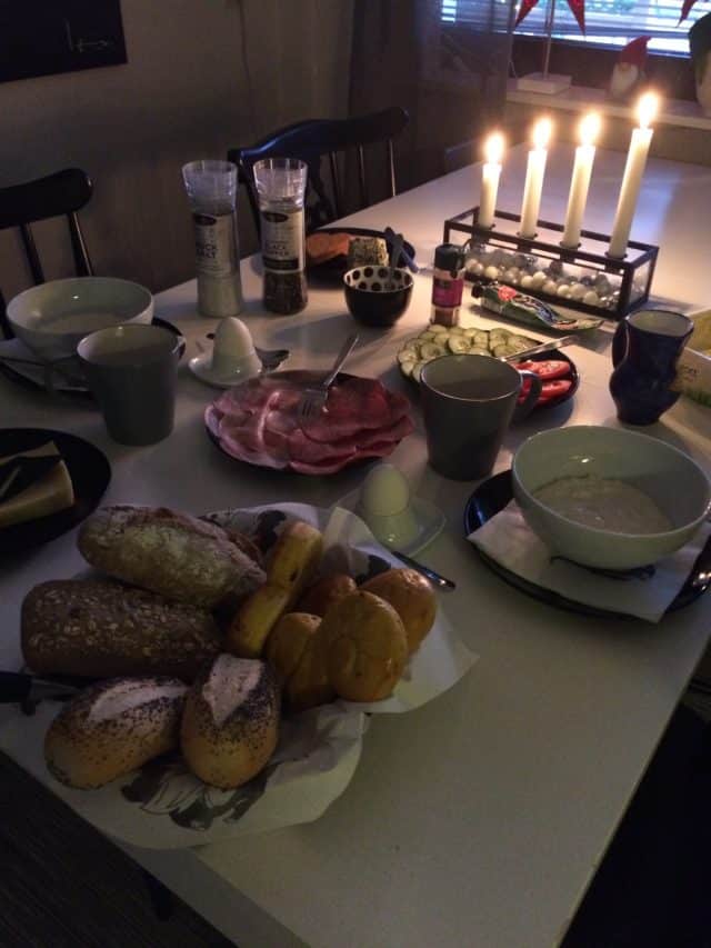 Swedish Christmas Breakfast With Bread Rice Porridge And Lit Candles