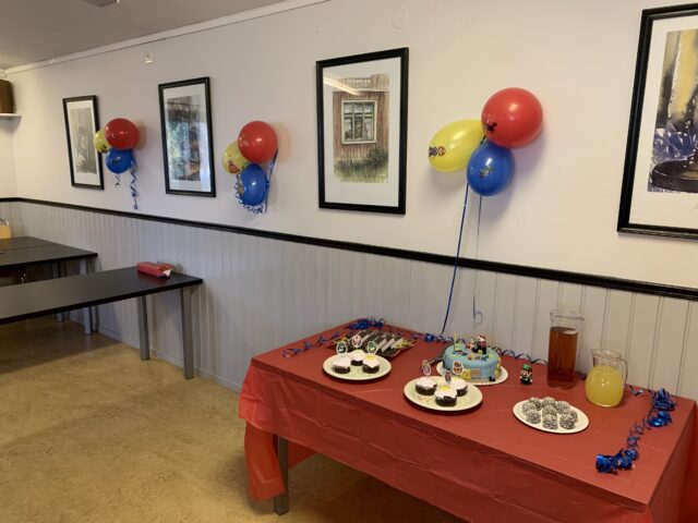 Child Birthday Party With Cake Balloons And Cupcakes