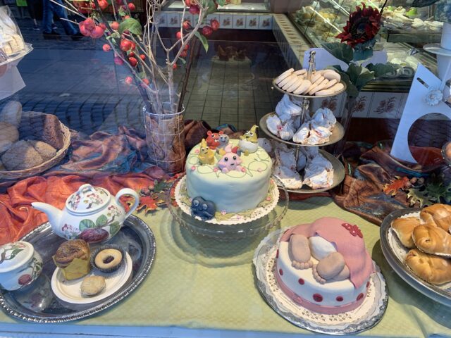 Creative Cakes And Pastries In A Bakery Window