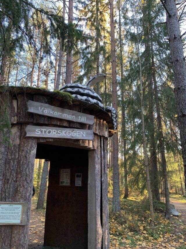 Forest Trail Wooden Log Hut With Welcome Signs
