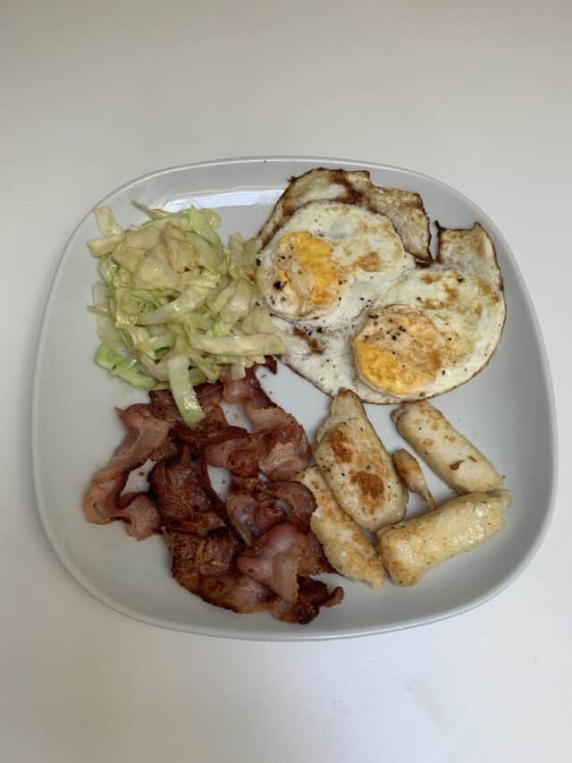 Fried Eggs And Bread With Bacon And Coleslaw