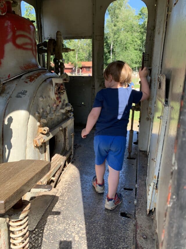 Child In A Classic Old Train Locomotive