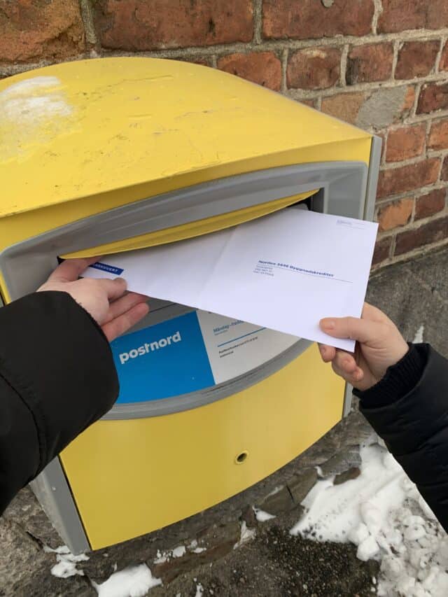 Putting Letter In Postnord Mailbox Dropbox