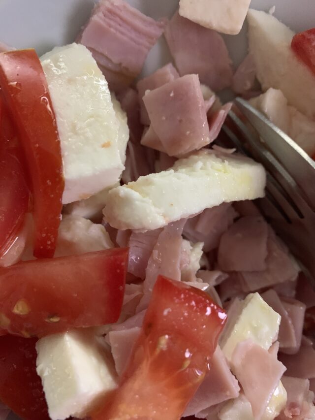 Mozzarella With Ham And Tomatoes With A Sprinkle Of Olive Oil