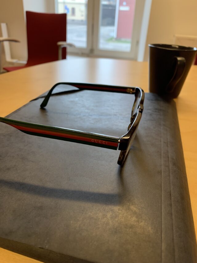 Document Paper Folder With Gucci Glasses And A Coffee Cup