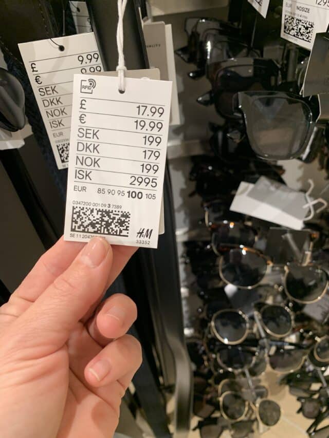 Rack Of Sunglasses In Store With Price Tags