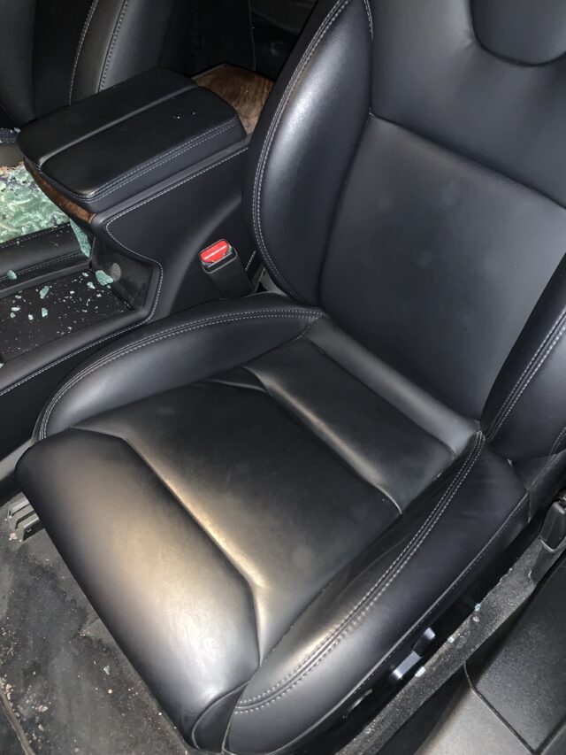Tesla Car Seat And Cabin With Broken Glass