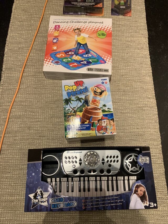 Toys And Games And A Synthesizer For Kids On The Floor