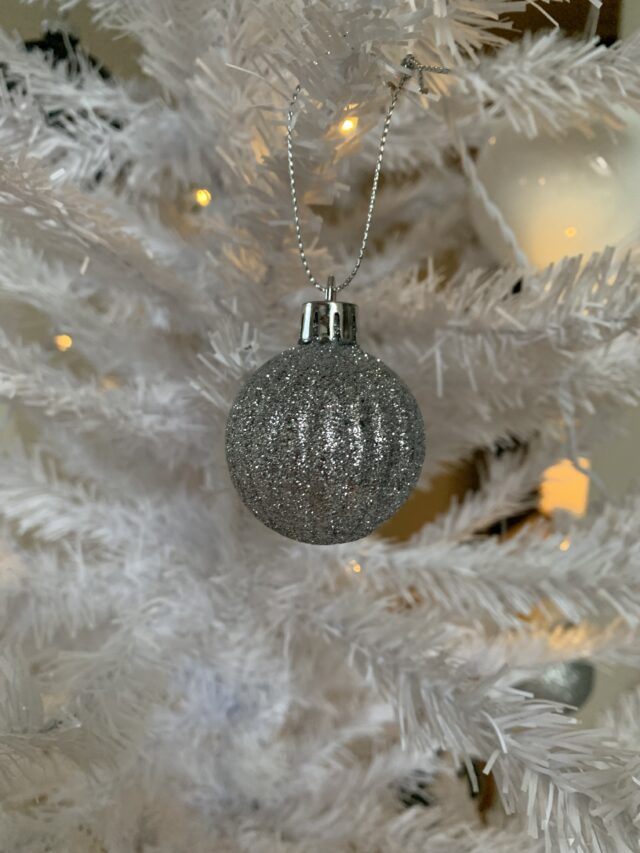 Glitter Bauble In White Christmas Tree With Lights